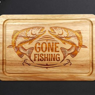 Gone Fishing chopping board on a grey worktop