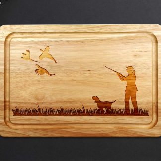 female pheasant shooting chopping board with Spaniel on grey worktop