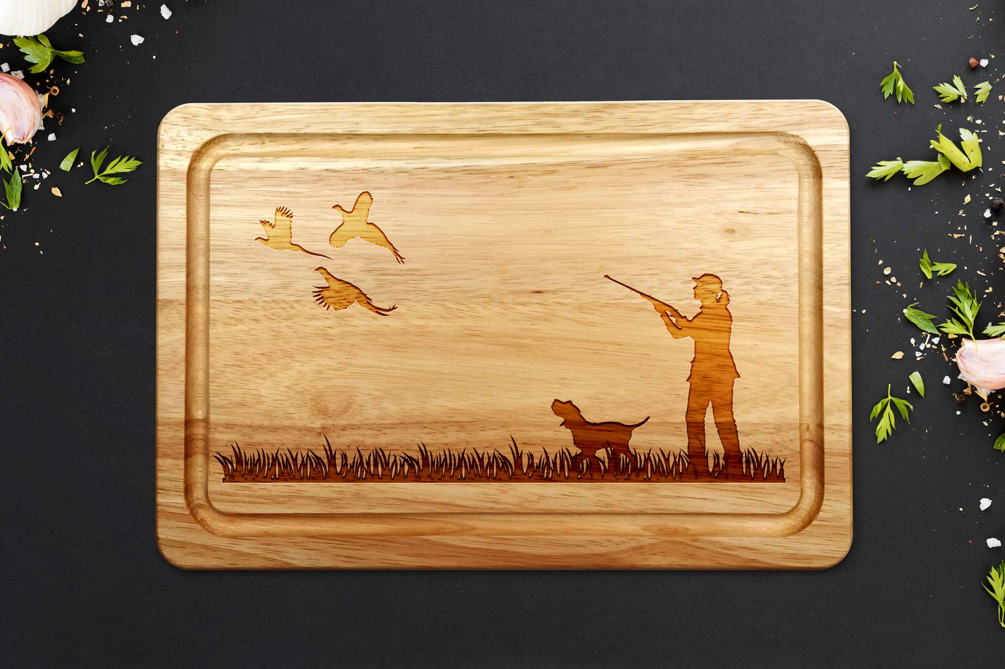 female pheasant shooting chopping board with Spaniel on grey worktop