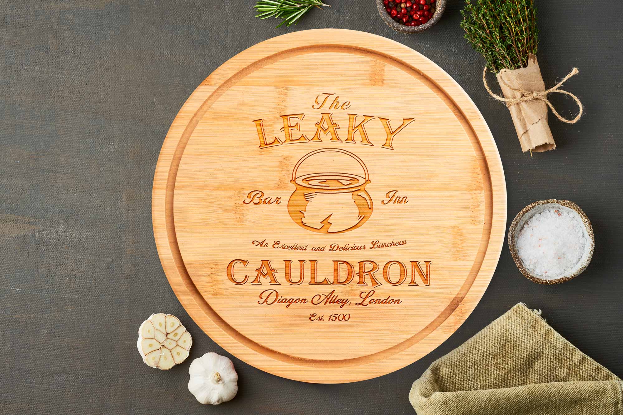 the leaky cauldron round chopping board on grey worktop